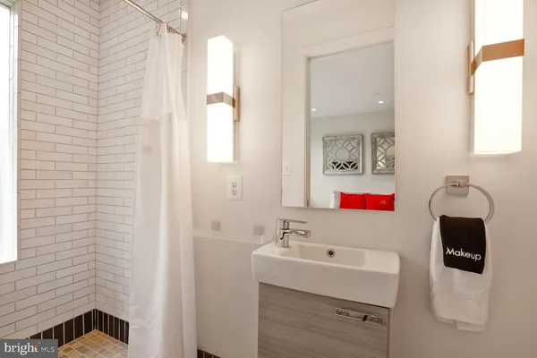 a balcony with table and chairs