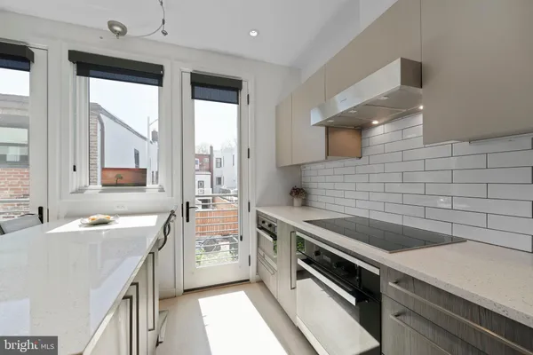 a view of a hallway with washer and dryer