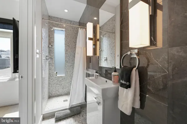 a view of a balcony with wooden floor and city view