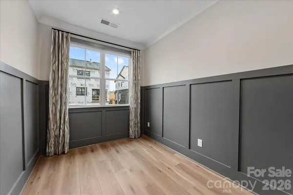 a view of entryway with wooden floor and stairs