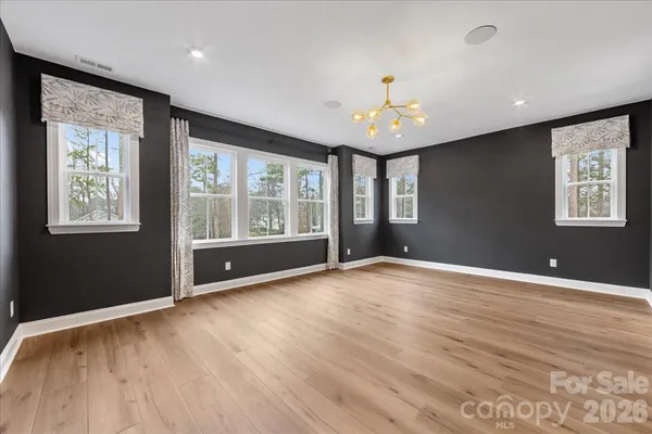 a bathroom with double sink and a mirror
