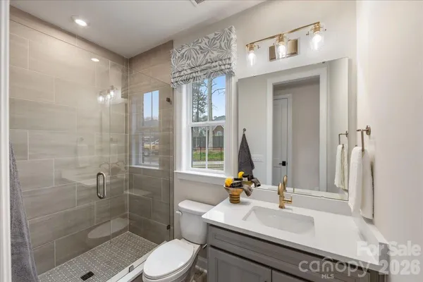 a bedroom with a large bed and a large window