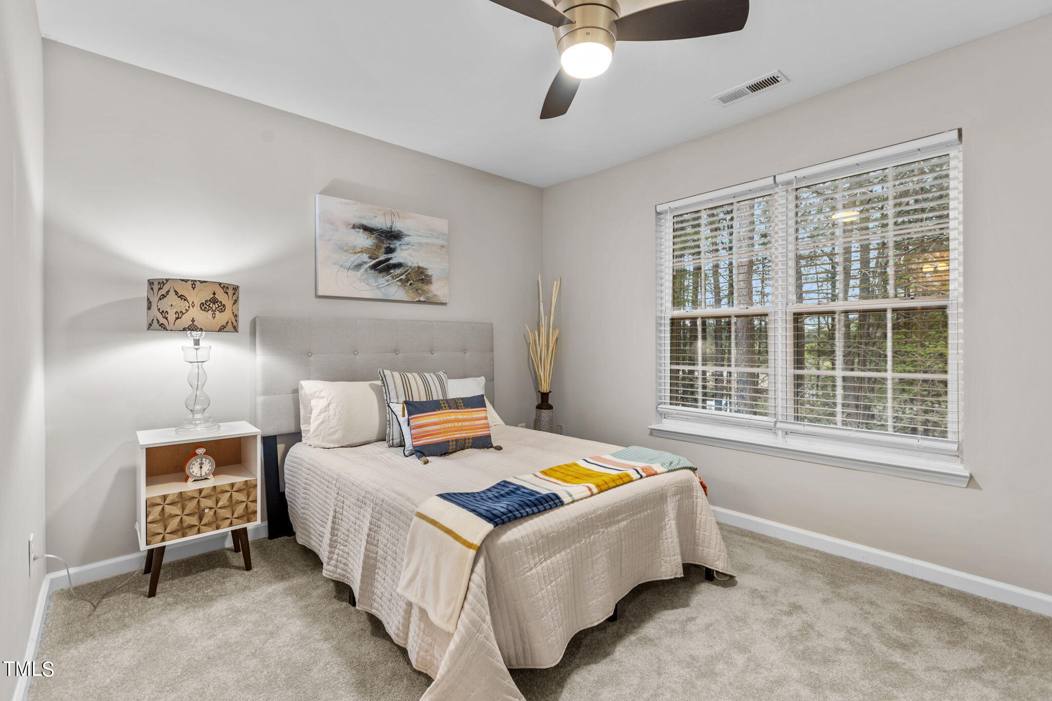 138 Blue Crest Lane Durham, NC 27705 - Photo 12 of 28 a bed room with a bed and a chair