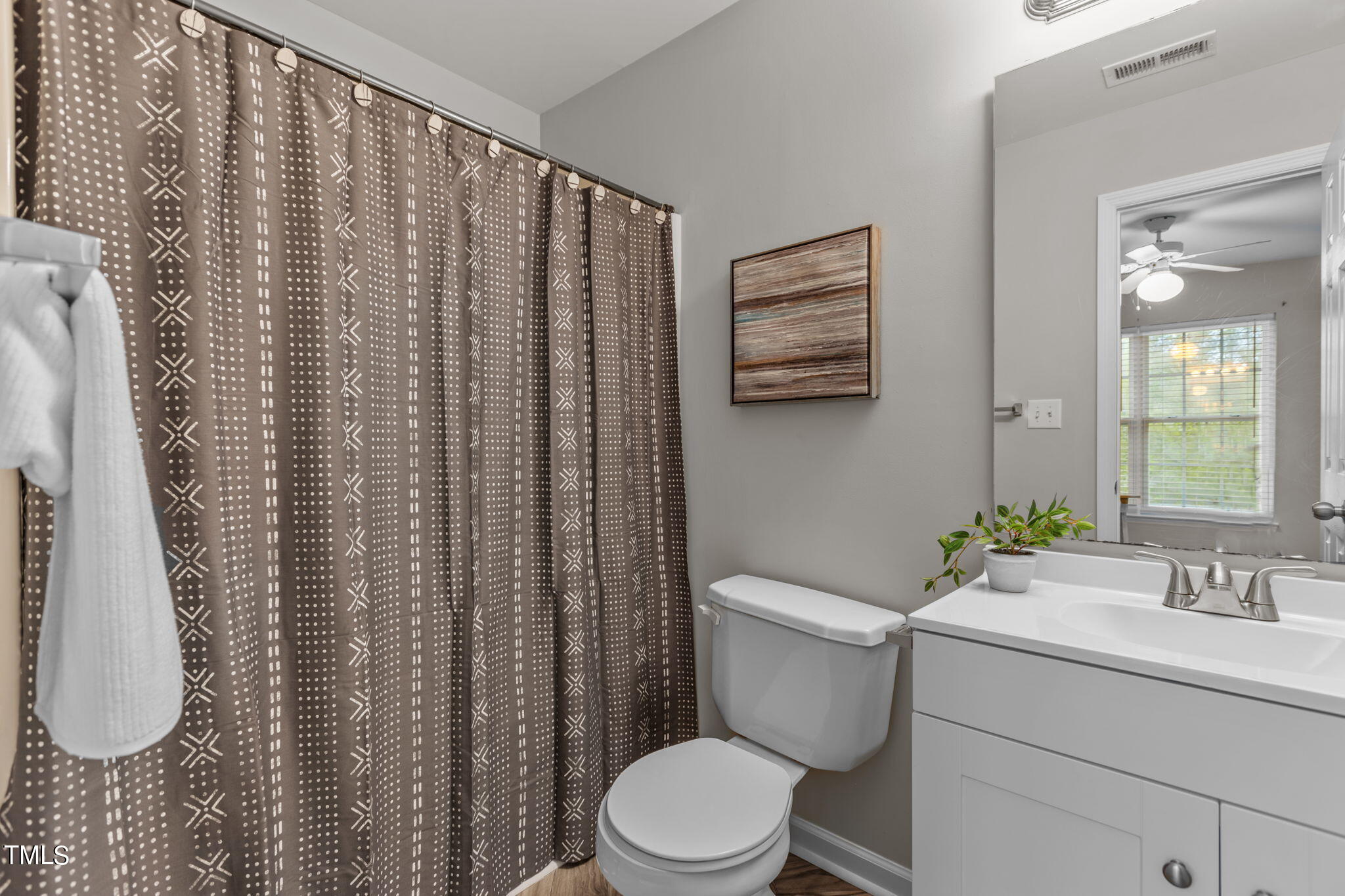 138 Blue Crest Lane Durham, NC 27705 - Photo 17 of 28 a bathroom with a sink a toilet and shower curtain