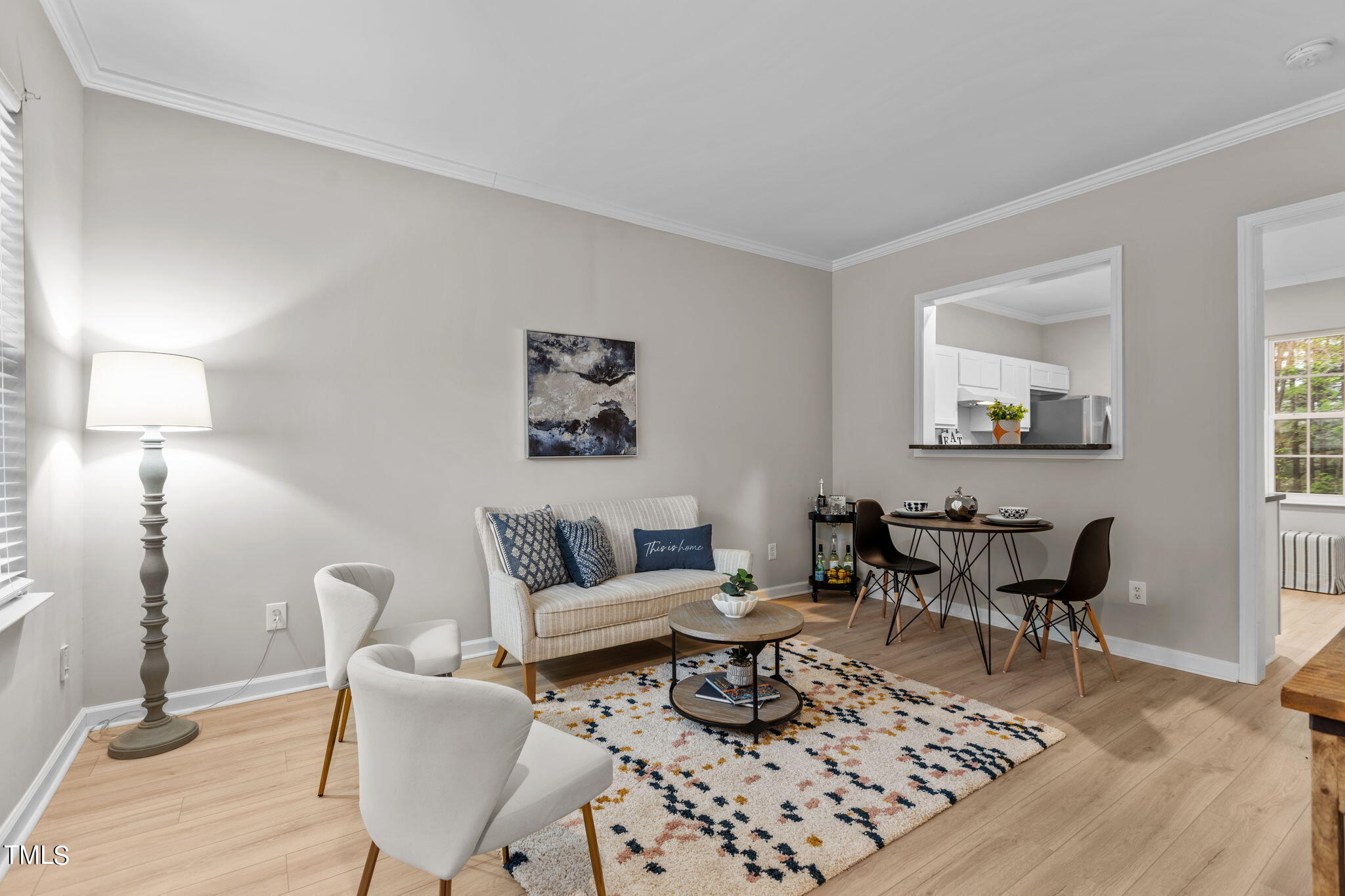 138 Blue Crest Lane Durham, NC 27705 - Photo 3 of 28 a living room with furniture a rug and a lamp
