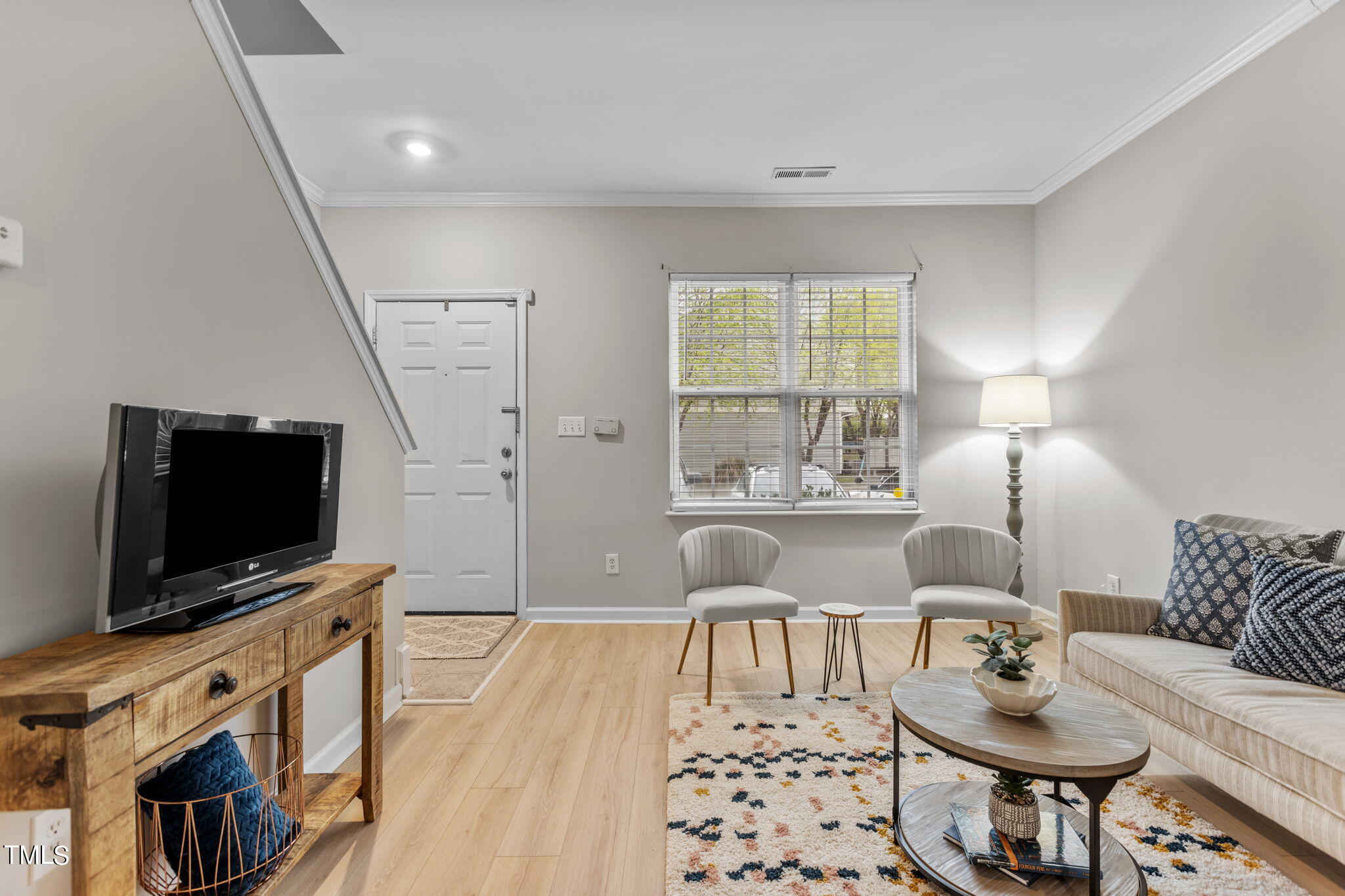 138 Blue Crest Lane Durham, NC 27705 - Photo 4 of 28 a living room with furniture and a flat screen tv