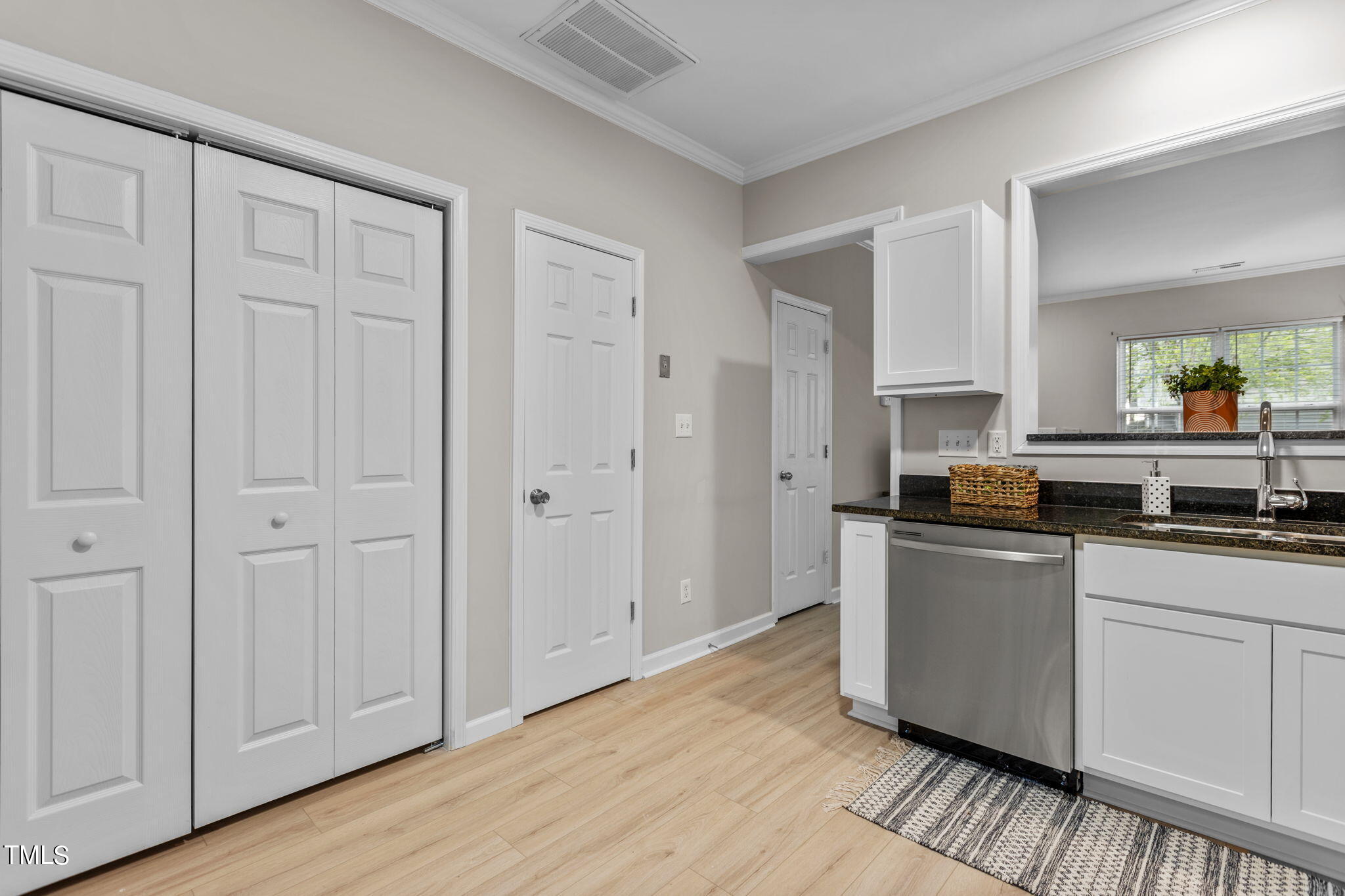 138 Blue Crest Lane Durham, NC 27705 - Photo 10 of 28 a kitchen with cabinets and wooden floor