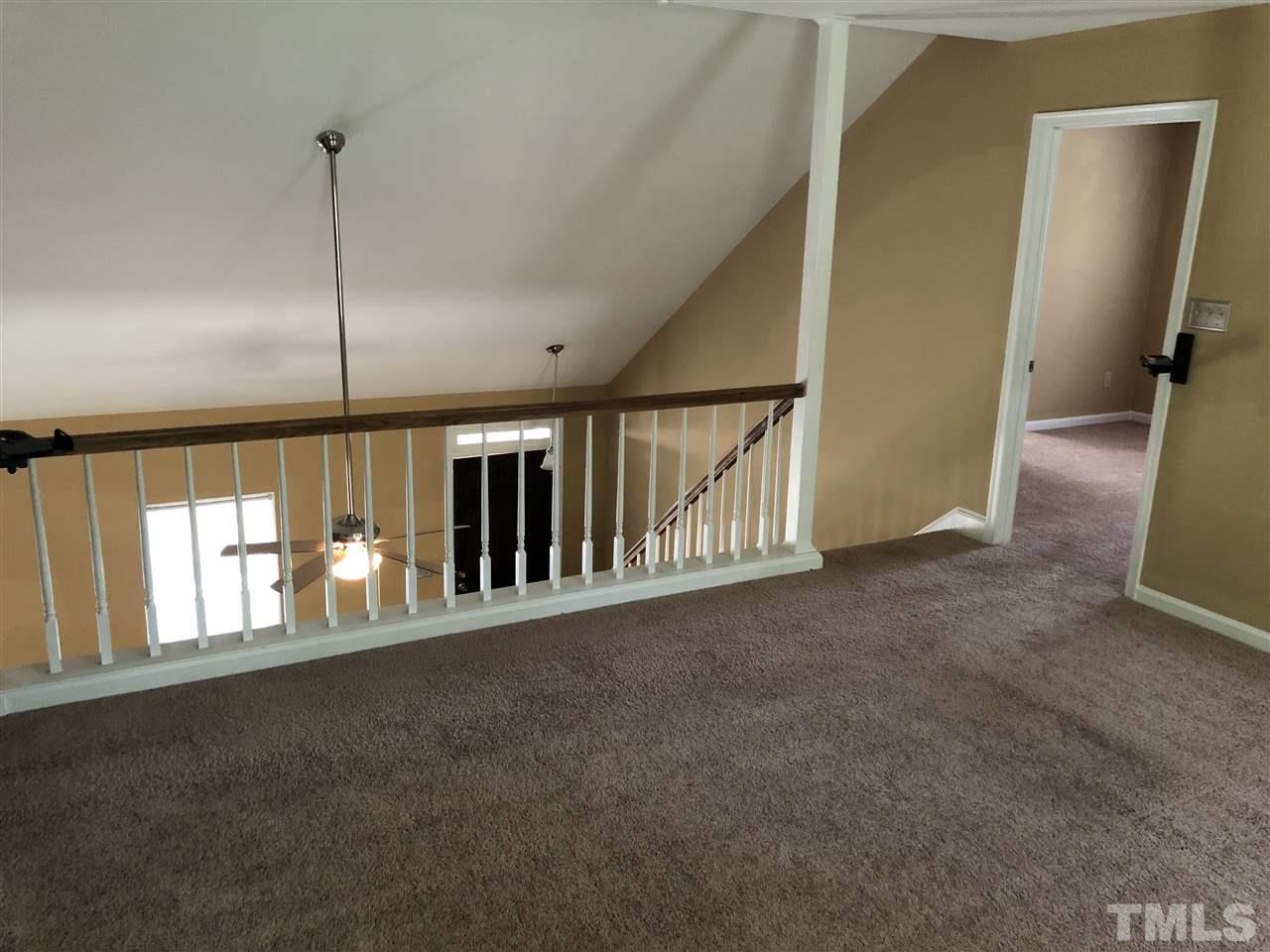 11812 North Exeter Way Raleigh, NC 27613 - Photo 14 of 25 a view of an empty room with a window