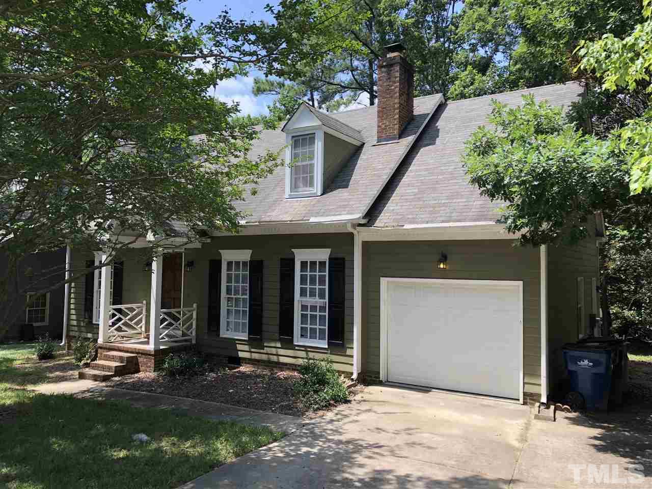 11812 North Exeter Way Raleigh, NC 27613 - Photo 19 of 25 a front view of a house with garden