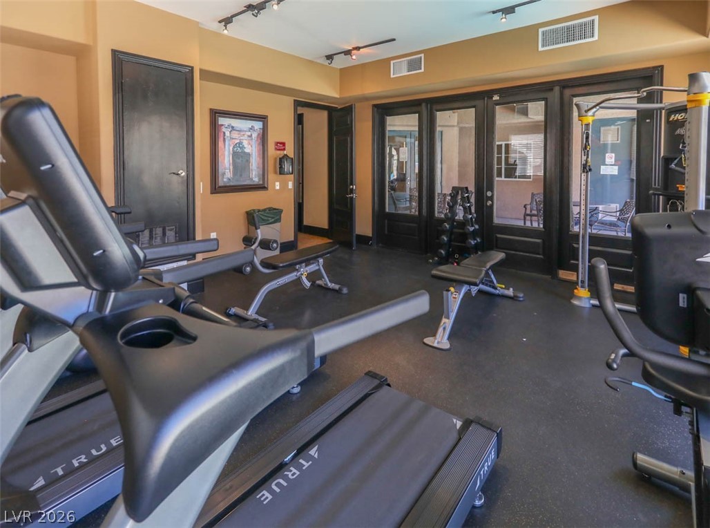 9940 Sable Point Street Las Vegas, NV 89178 - Photo 37 of 40 Gym with rail lighting and french doors