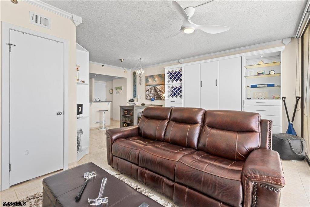 3851 Boardwalk, Unit 2005 Atlantic City, NJ 08401 - Photo 14 of 28 a living room with furniture and a window