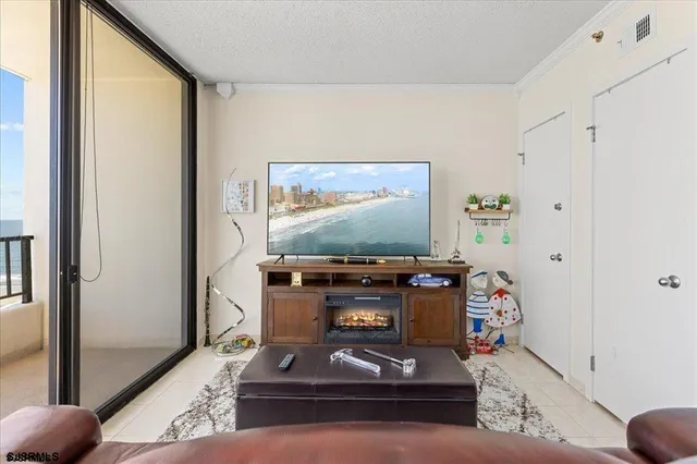 a room with furniture and flat screen tv