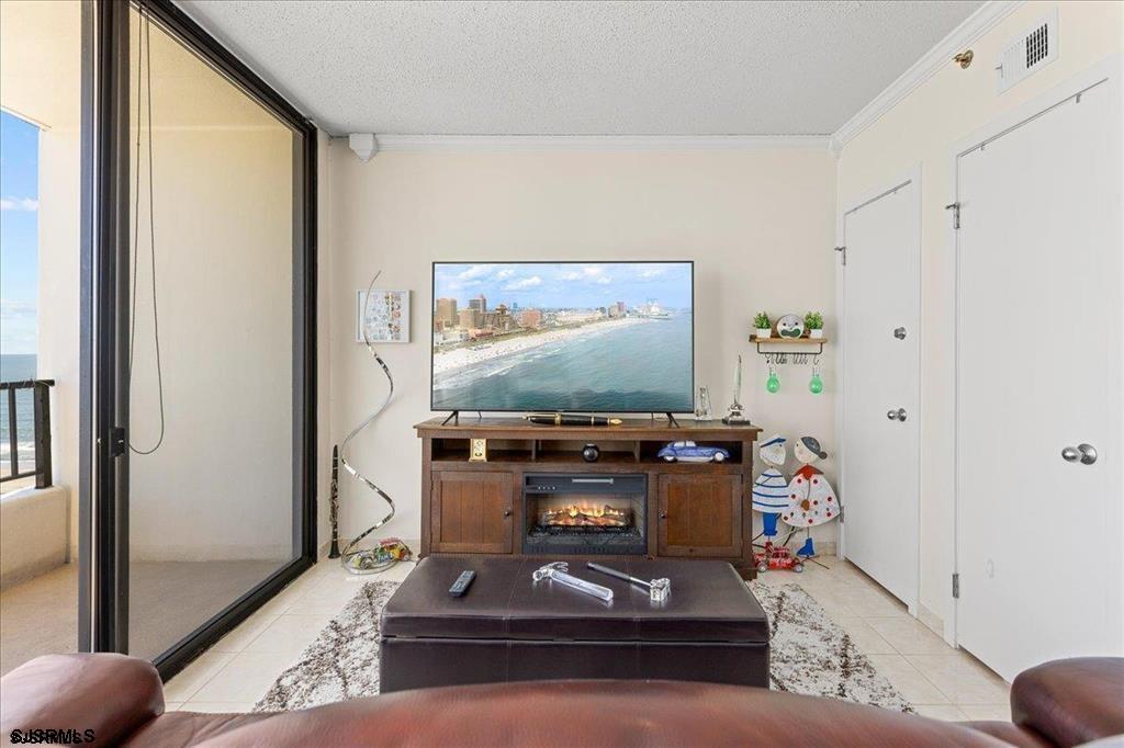 3851 Boardwalk, Unit 2005 Atlantic City, NJ 08401 - Photo 16 of 28 a room with furniture and flat screen tv