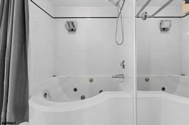 a bathroom with a bath tub