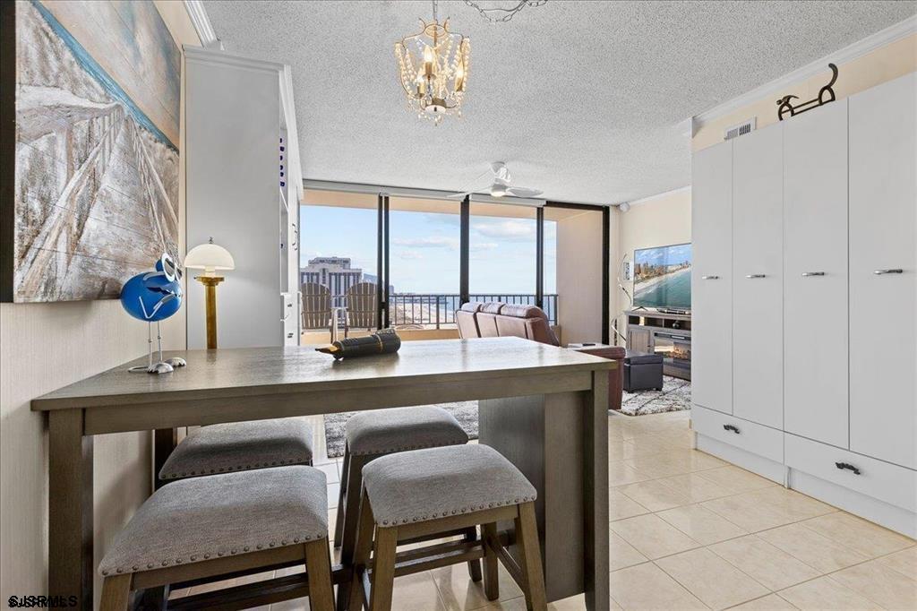 3851 Boardwalk, Unit 2005 Atlantic City, NJ 08401 - Photo 4 of 28 a dining room with furniture and window