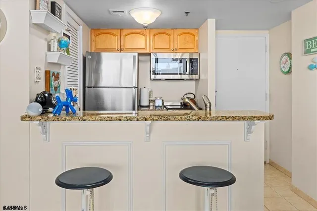 a bathroom with a sink and a chair