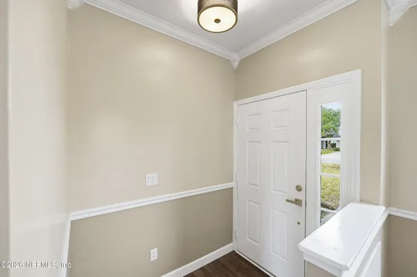 a view of room with window and hallway