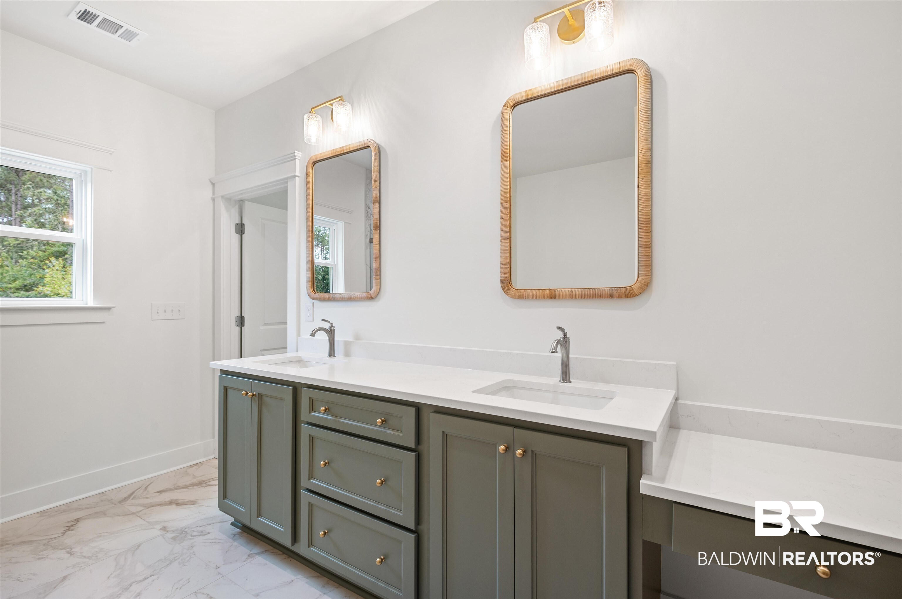 657 Island Way Gulf Shores, AL 36542 - Photo 20 of 59 Full bathroom featuring marble look tiles, double vanity, and baseboards
