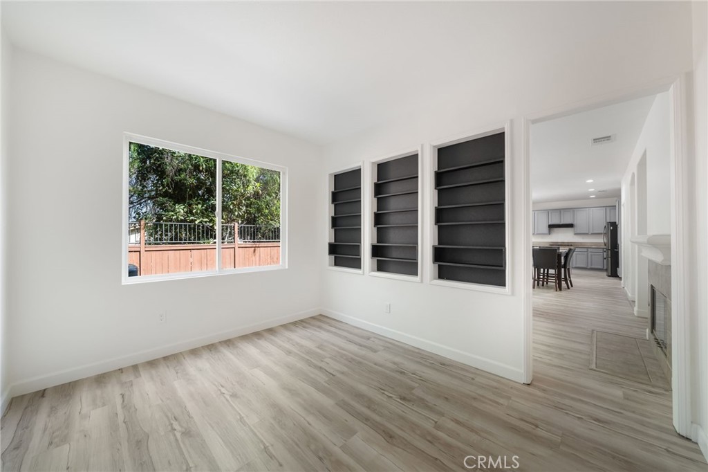 1729 Bridlevale Road Chula Vista, CA 91913 - Photo 14 of 44 wooden floor in an empty room with a window