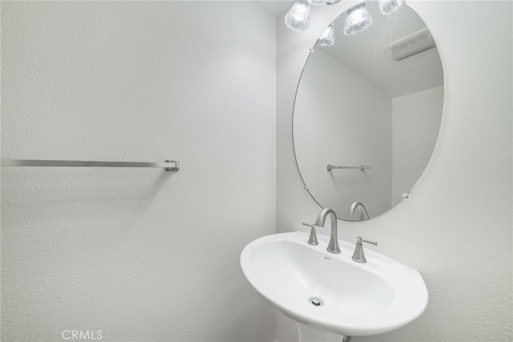 1729 Bridlevale Road Chula Vista, CA 91913 - Photo 16 of 44 a bathroom with a sink and a mirror