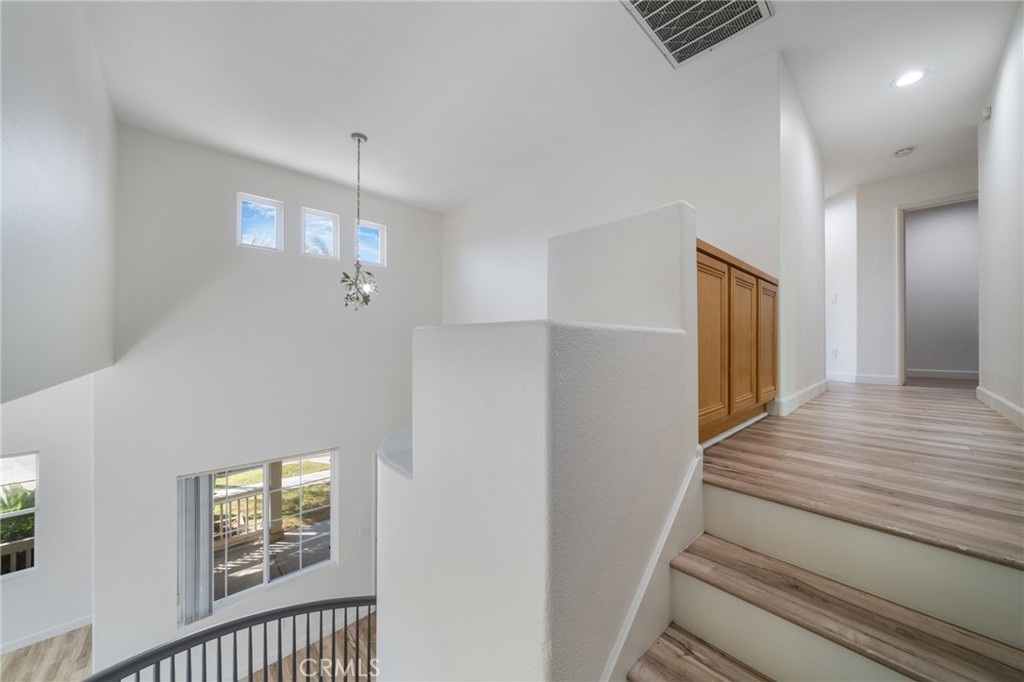 1729 Bridlevale Road Chula Vista, CA 91913 - Photo 17 of 44 a view of entryway and hall with wooden floor