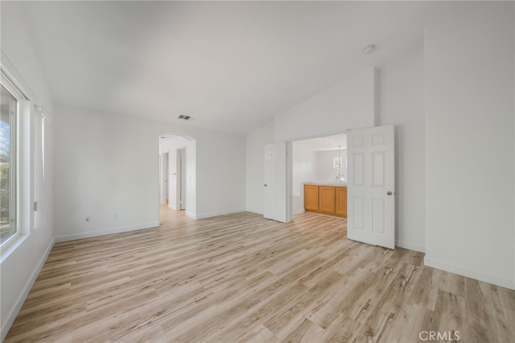 1729 Bridlevale Road Chula Vista, CA 91913 - Photo 18 of 44 a view of empty room with wooden floor and window