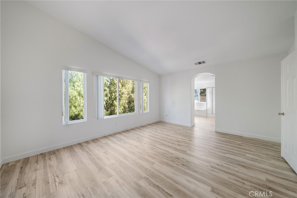 1729 Bridlevale Road Chula Vista, CA 91913 - Photo 20 of 44 an empty room with wooden floor and windows
