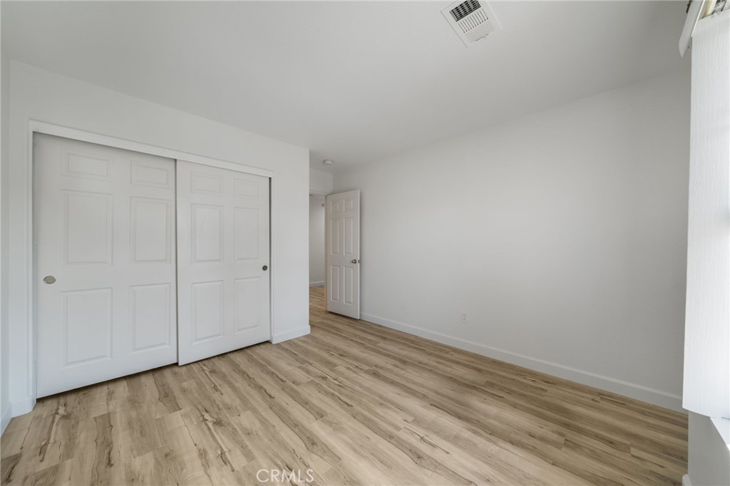 1729 Bridlevale Road Chula Vista, CA 91913 - Photo 26 of 44 a view of an empty room with wooden floor