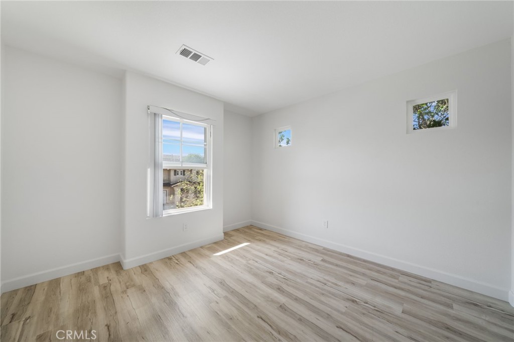 1729 Bridlevale Road Chula Vista, CA 91913 - Photo 27 of 44 wooden floor in an empty room with a window