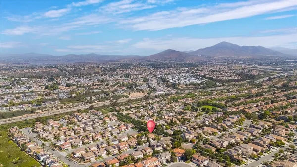 an aerial view of residential house and mountain view
