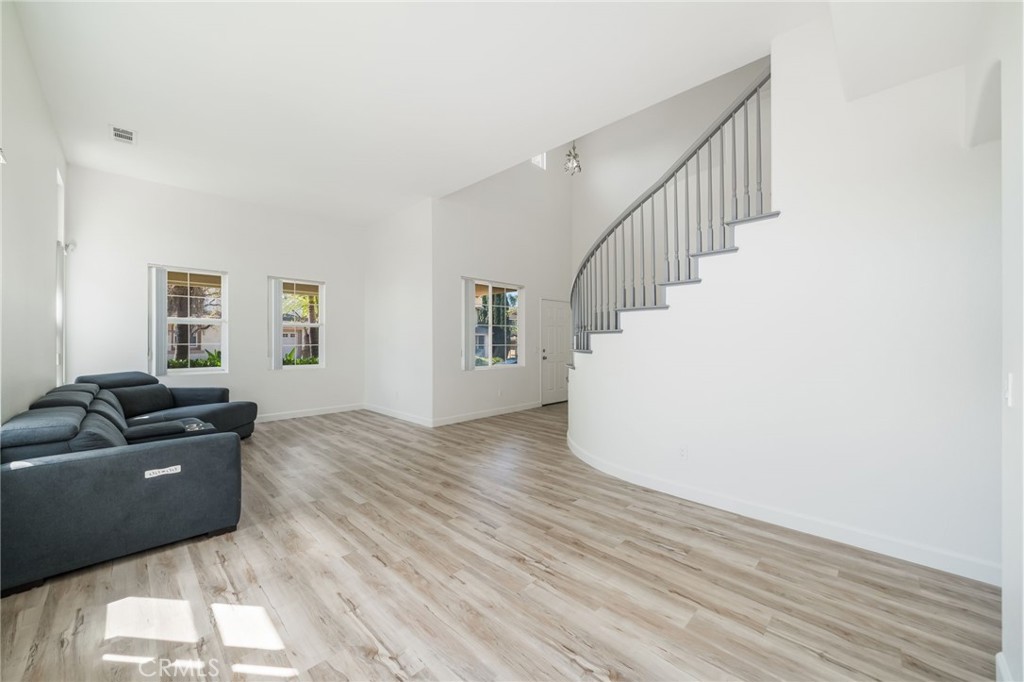 1729 Bridlevale Road Chula Vista, CA 91913 - Photo 6 of 44 a living room with furniture and a wooden floor