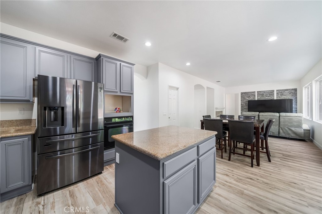 1729 Bridlevale Road Chula Vista, CA 91913 - Photo 44 of 44 a kitchen with kitchen island a counter top space stainless steel appliances and cabinets
