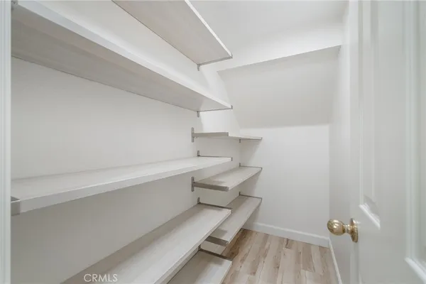 a large kitchen with kitchen island a sink table and chairs