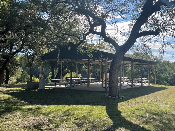 a view of a lake with a yard