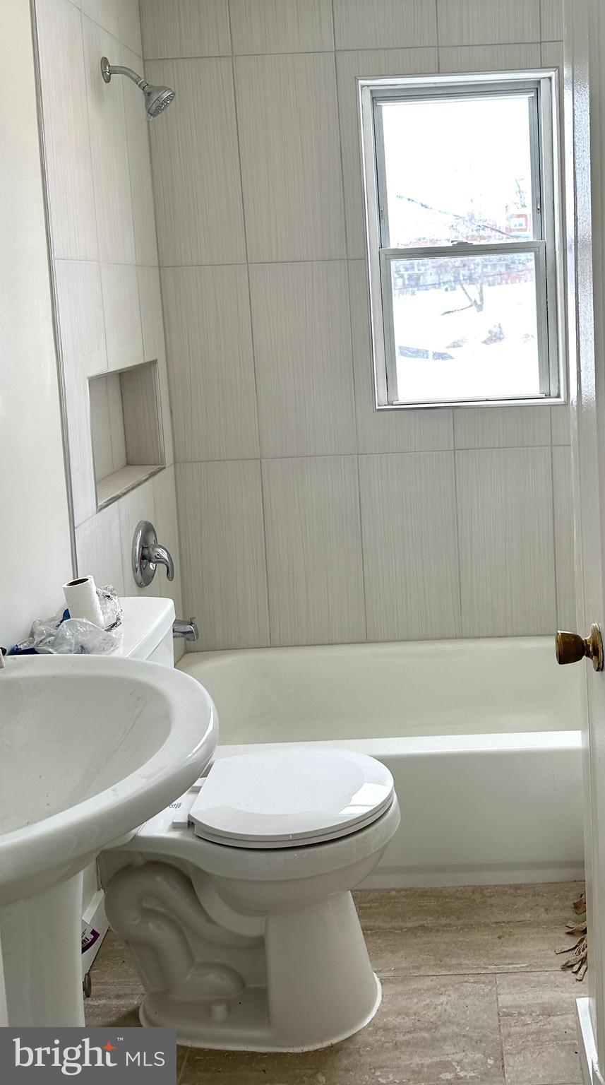 4304 Roberton Avenue Baltimore, MD 21206 - Photo 9 of 11 a bathroom with a sink toilet and bathtub