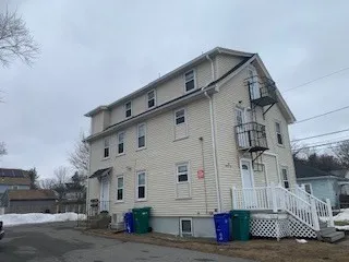 a view of a street with big house