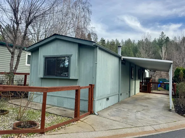 a house with trees in the background