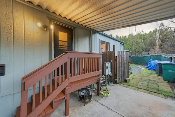 a view of a deck with a table and chairs