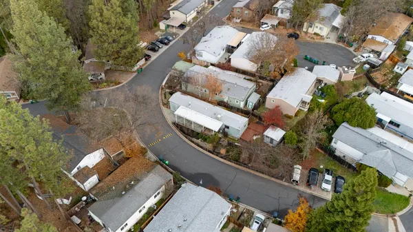 an aerial view of a house with a swimming pool