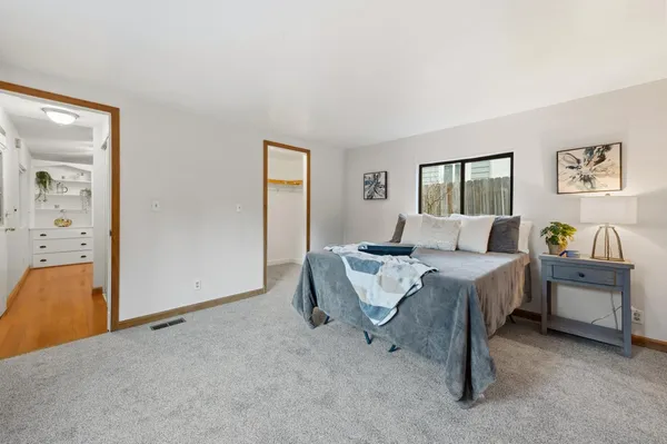 a bed room with a bed and a couch