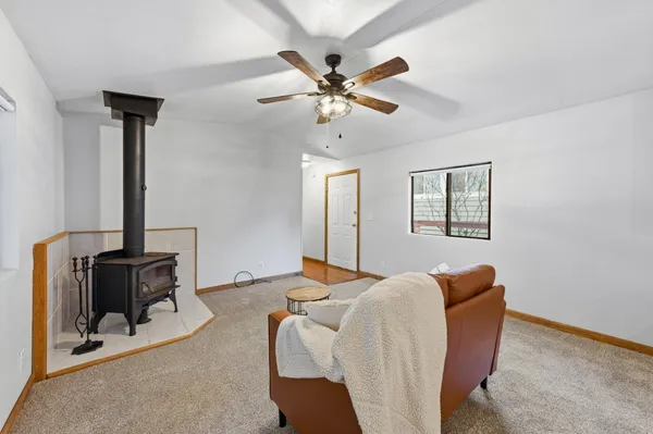 a bedroom with bed and a window