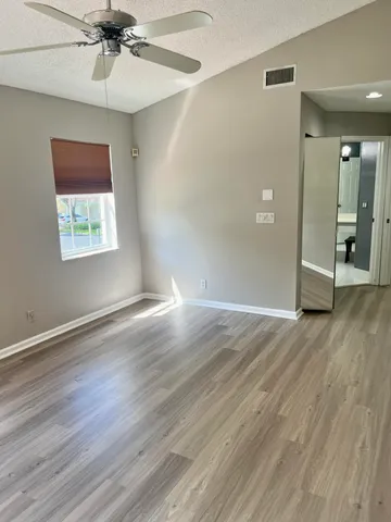 a bathroom with a double vanity sink toilet and a mirror