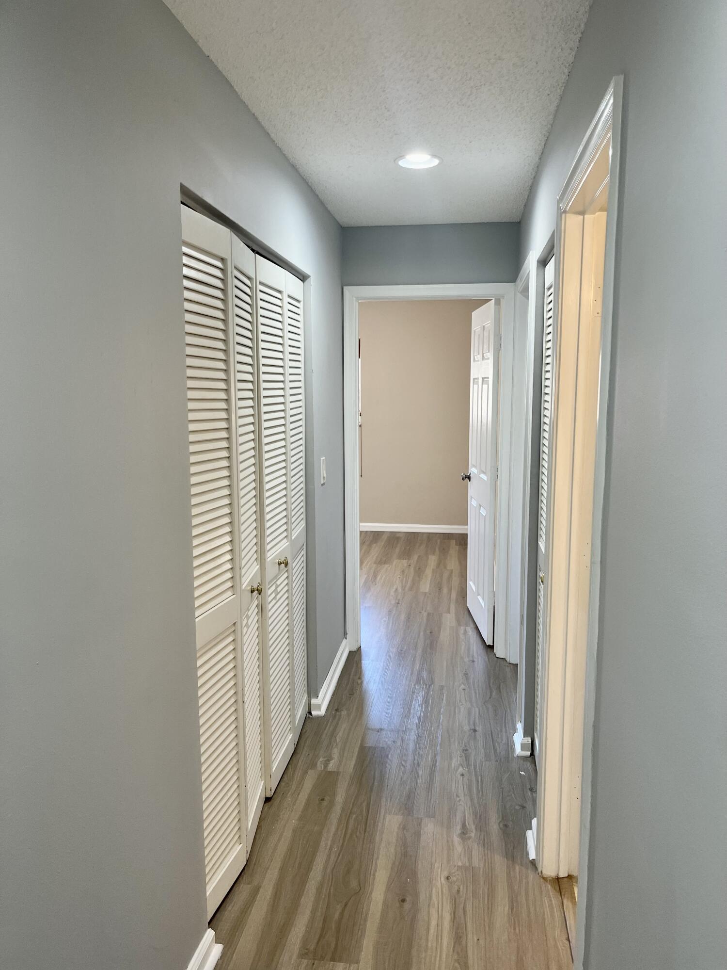 17262 Boca Club Boulevard, Unit 2407 Boca Raton, FL 33487 - Photo 17 of 25 wooden floor in an empty room with a window