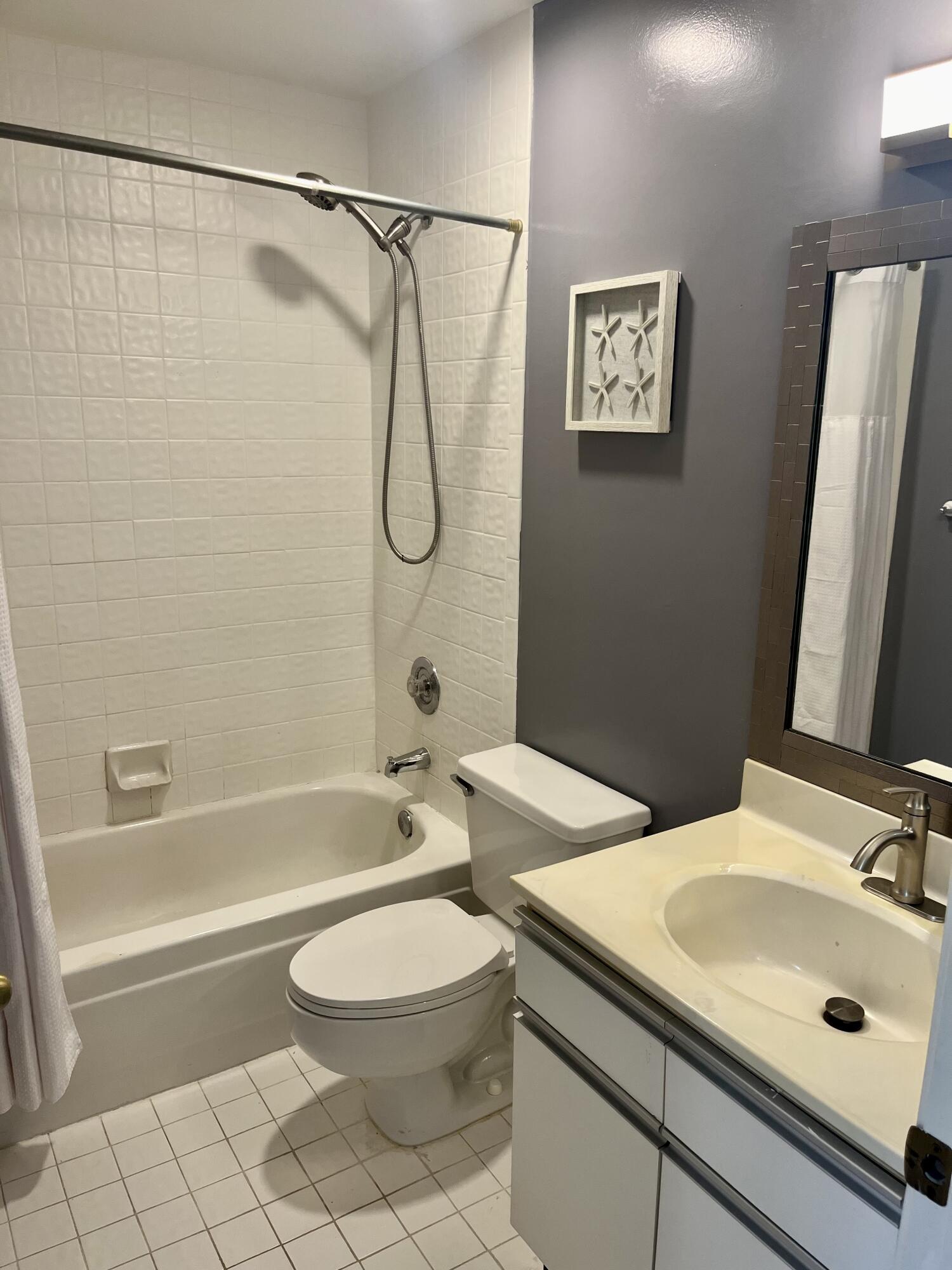 17262 Boca Club Boulevard, Unit 2407 Boca Raton, FL 33487 - Photo 18 of 25 a bathroom with a sink a toilet and a bathtub