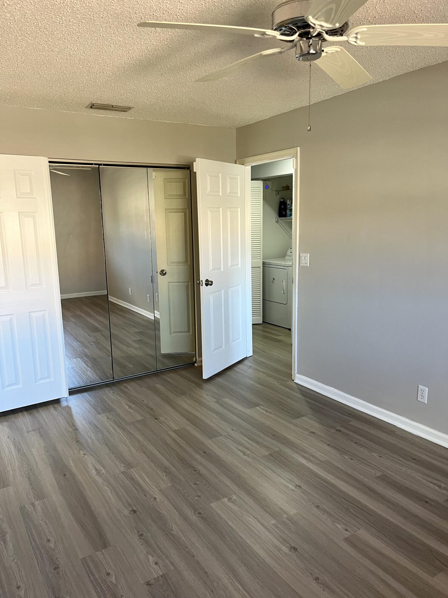 17262 Boca Club Boulevard, Unit 2407 Boca Raton, FL 33487 - Photo 19 of 25 a view of an empty room with wooden floor