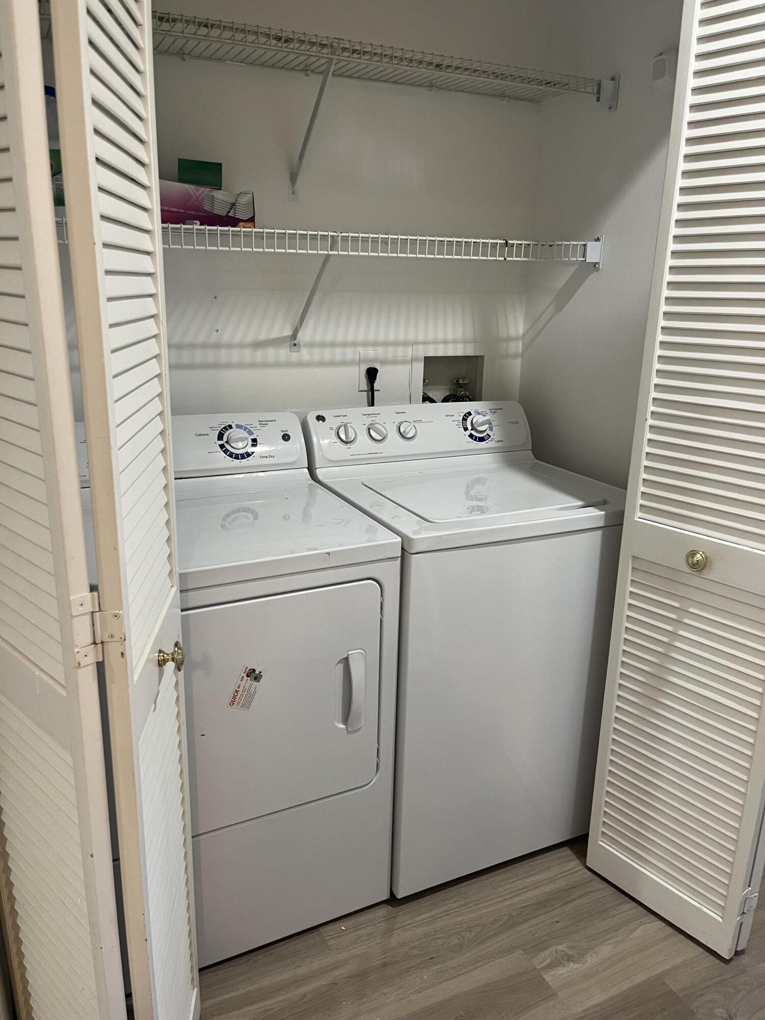 17262 Boca Club Boulevard, Unit 2407 Boca Raton, FL 33487 - Photo 25 of 25 a utility room with dryer and washer