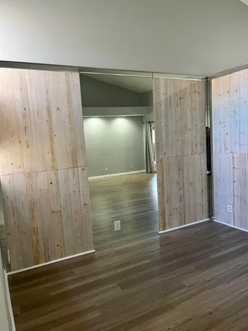 a view of a hallway view and wooden floor and staircase