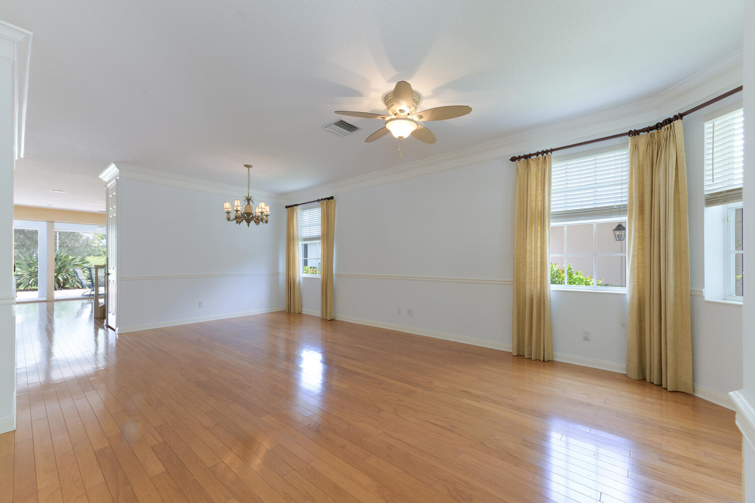 244 Barbados Drive Jupiter, FL 33458 - Photo 12 of 51 a view of an empty room with window and wooden floor