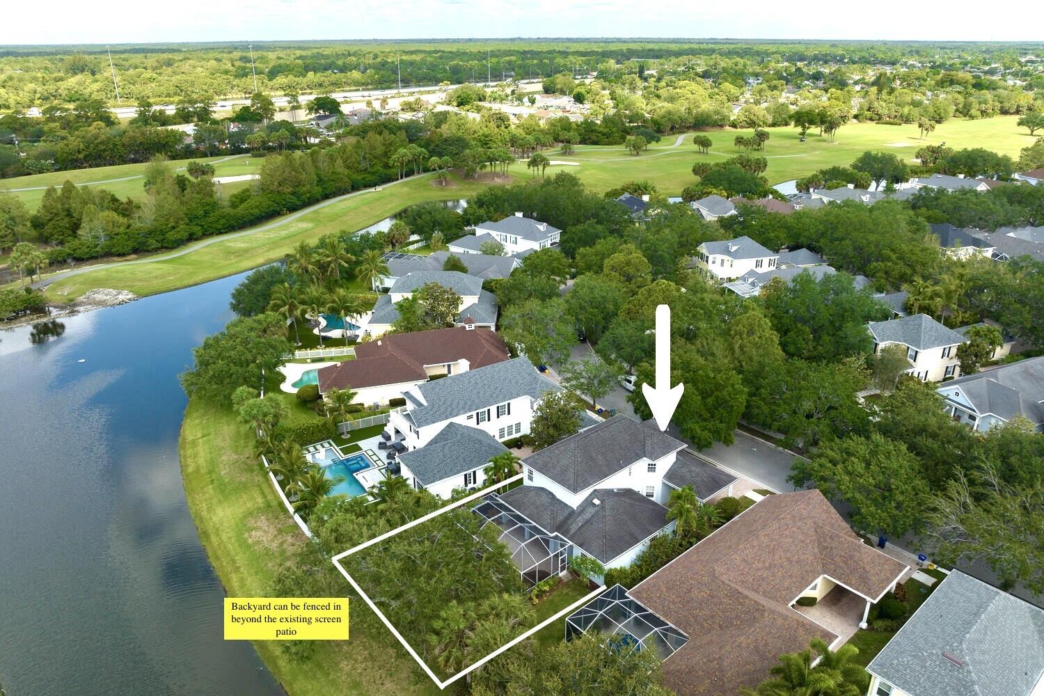 244 Barbados Drive Jupiter, FL 33458 - Photo 2 of 51 an aerial view of a house with a yard