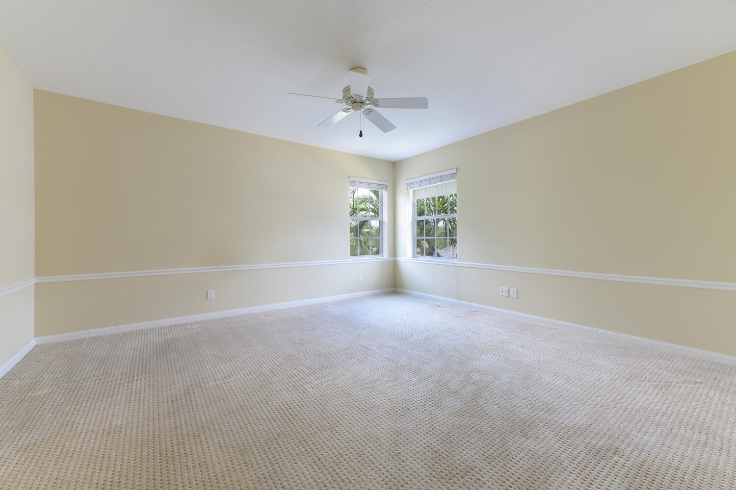 244 Barbados Drive Jupiter, FL 33458 - Photo 27 of 51 an empty room with a ceiling fan and window